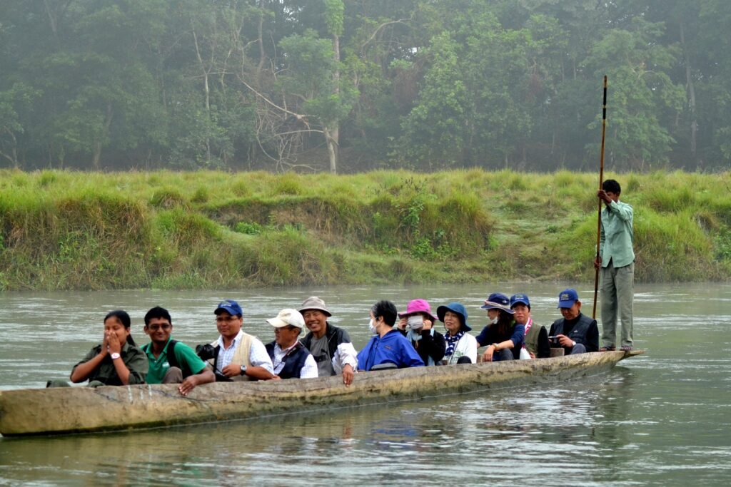 Dugout canoe ride on the Rapti River, part of the Chitwan safari package in Sauraha